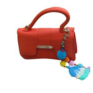 Adorable orange purse with shoulder strap.  NWOT